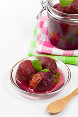 Whole Plum Compote. Selective focus.