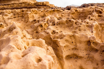 Close-up view on white stone coast near Ajuy village on Fuerteventura island in Spain