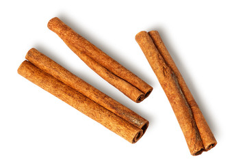 Three cinnamon sticks lie nearby