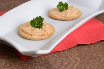 crackers with salmon pate and parsley