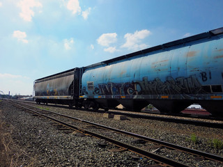 Fototapeta na wymiar Industrial vintage train car perspective - landscape color photo