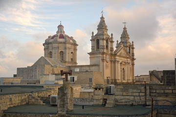 Fototapeta na wymiar View of St Pauls Cathedral in Mdina, Malta from the roof of Palazzo Falson.