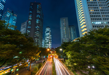 Fototapeta na wymiar traffic light trails in a dark night in Tokyo, Japan