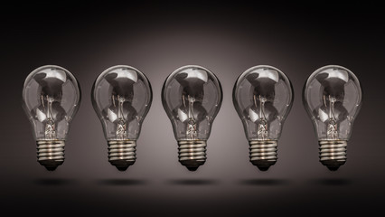 Light bulb lamps on a colour background.