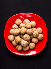 walnuts in red plate