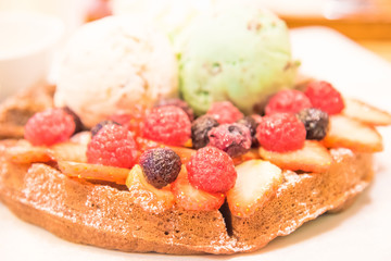 Ice in fresh Pan Cake with mixed fruits on black background