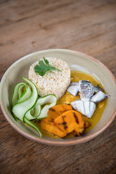 Thai healthy food brown rice with pumpkin soup.