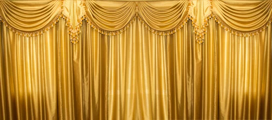 Lichtdoorlatende gordijnen Theater luxe gele gouden gordijnen textuur achtergrond op theater bioscoop podium behang