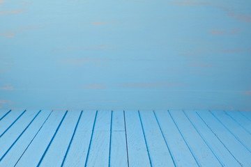 Empty wooden blue table over blue wall. Kitchen background
