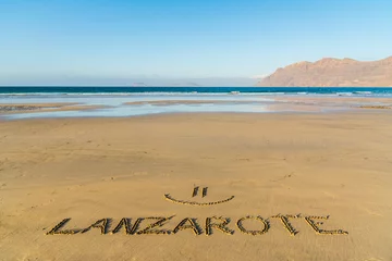 Fototapeten Lanzarote text written on the beach, Lanzarote, Canary Islands, Spain © Fominayaphoto