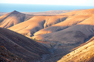 Fototapeta na wymiar Beautiful landscape with soft mountains on the central part of Fuerteventura island in Spain