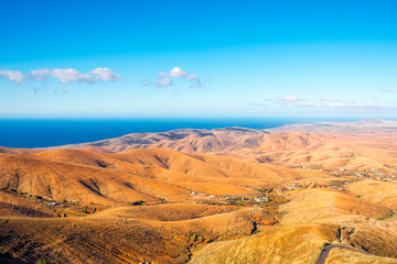 Aerial view on Fuerteventura island from Morro Velosa viewpoint with beautiful soft mointains landscape