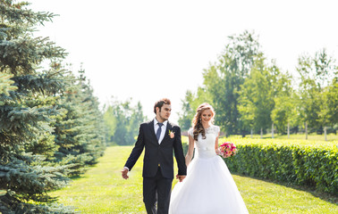 Romantic wedding couple having fun together outdoor in nature