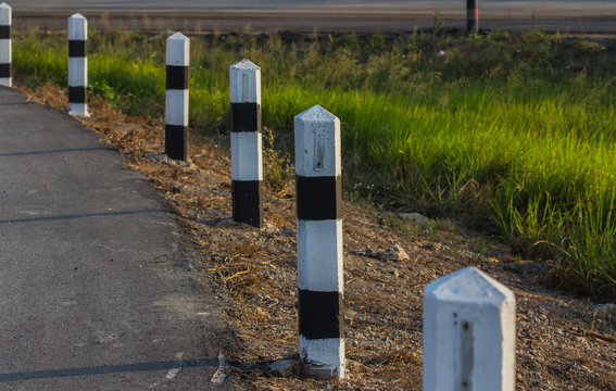 Black and white pole in wayside 