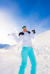 Fototapeta na wymiar Woman skier in the mountains
