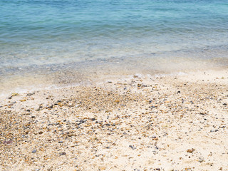 Clear blue water and beach in the tropical climate of Thailand.