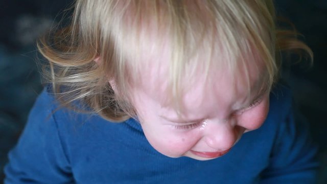Funny baby boy blonde hairs cry