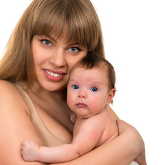 Portrait of beautiful smiling young mother with a baby