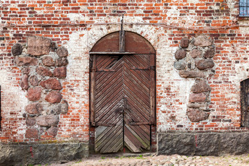 Old wooden gate at the medieval castle in Vyborg, Russia