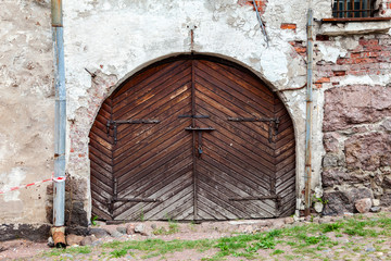 Old wooden gate at the medieval castle in Vyborg, Russia