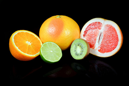 Fresh citrus isolated on black background with reflections