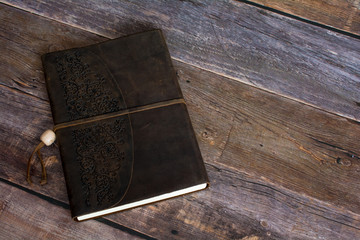 Classic Leather Bound Journal Book on a Old Barn Board Floor