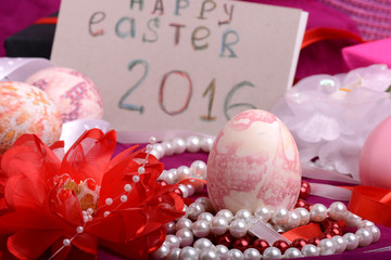Easter eggs and flowers on background with gift box