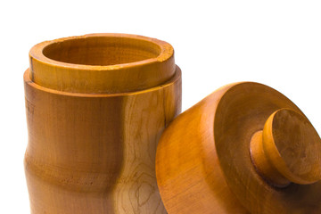 Wooden jar with lid off closeup leaning on front