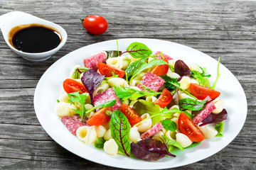 lettuce leaves, salami , nuts, honey, sesame seeds sauce, close-