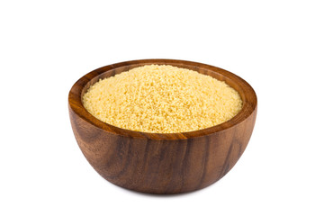Raw couscous in a wooden bowl