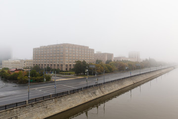 Sunrise in the foggy morning  over Moscow city.