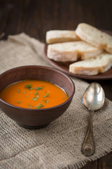 Pumpkin soup on a wooden table