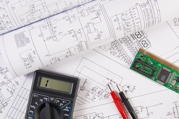 electrical engineering drawings, electronic board and digital multimeter