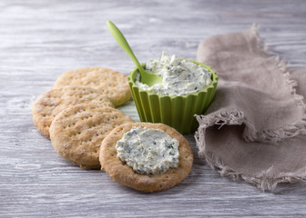 Homemade oat wheat flat bread with dip sauce on wooden table 