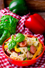 pasta salad with  sausages and vegetables. selective focus