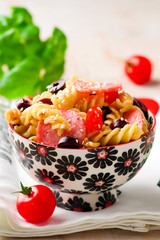 pasta salad with  sausages and vegetables. selective focus