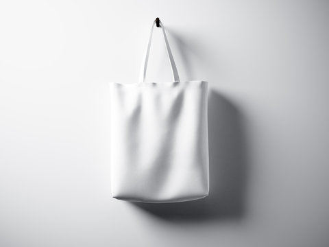 Photo white cotton textile bag hanging center. Empty abstract wall background. Highly detailed texture, space for advertising. Horizontal. 3d render