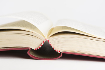 An open red hardcovered book