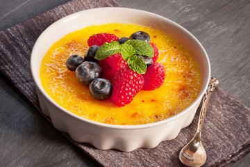 Creme brulee Dessert wih fruits and mint leaves