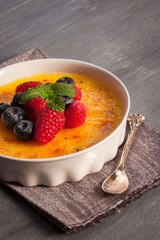 Creme brulee Dessert wih fruits and mint leaves