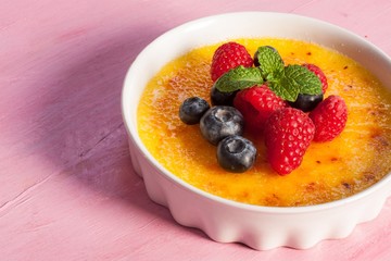 Creme brulee Dessert wih fruits and mint leaves