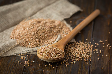 buckwheat groats and wooden spoon