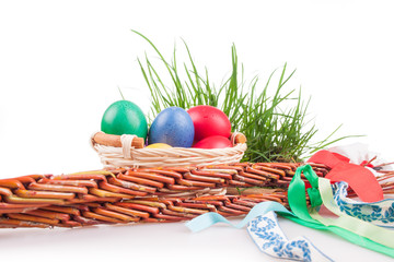 Easter colored eggs in a basket with Easter Caroling
