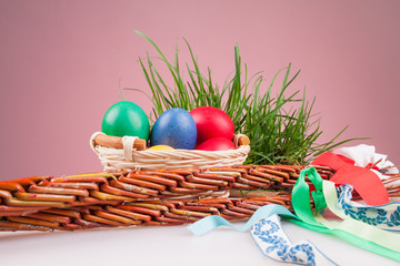Easter colored eggs in a basket with Easter Caroling