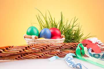Easter colored eggs in a basket with Easter Caroling