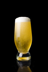 glass of beer on a black background