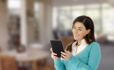 Beautiful girl smiling reading on a table portrait