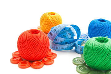 balls of yarn, buttons and meter