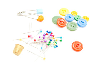 colored pins, thimble and buttons