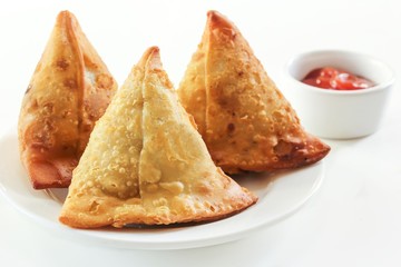 Samosas Indian snack food on white background